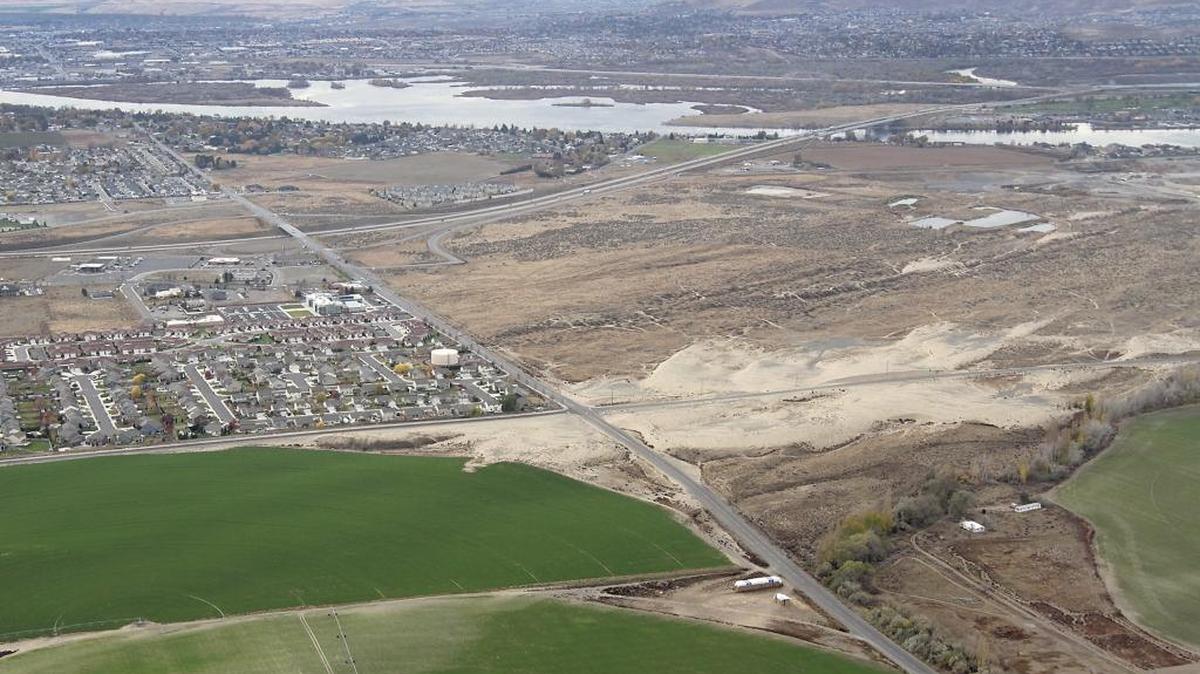 A one mile section of Broadmoor Boulevard, between Burns and Dent roads, is closed for two months for utility installation and roadway construction. A portion of the affected Pasco road, that is north of Interstate 182, can be seen in the lower half of this aerial photo.