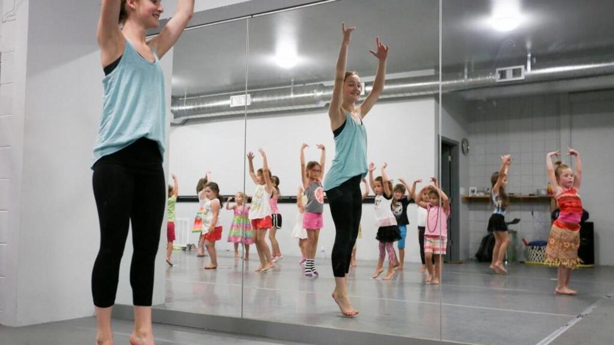 Jordon Moos, assistant instructor, leads students in a dance during a “Princess Moana Luau” class on Wednesday at Synergy Dance Project’s studio in Kennewick. The class is three days for two hours, and the students perform for their parents on the final day. For more information, go to synergydanceproject.com.