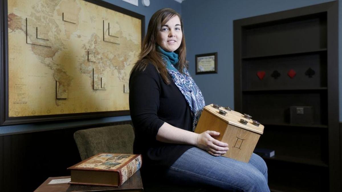 Sarah Swoboda, owner of PerplEXIT, sits in “gemini,” the Tri-Cities’ first live-action puzzle room. Participants search the room for hidden objects and secret messages to solve the puzzles and unravel the mystery of the room before time runs out. See a video at www.tricityherald.com/video.