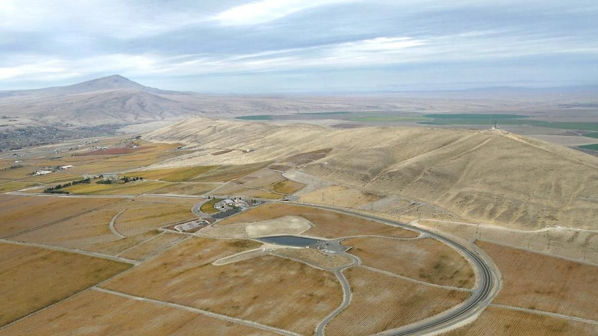 The proposed trailhead parking lot for the Red Mountain hiking area is visible near the dirt road at the base of the mountain on the right of this aerial photo, next to the paved Antinori Road leading to the Col Solare Winery near Benton City.