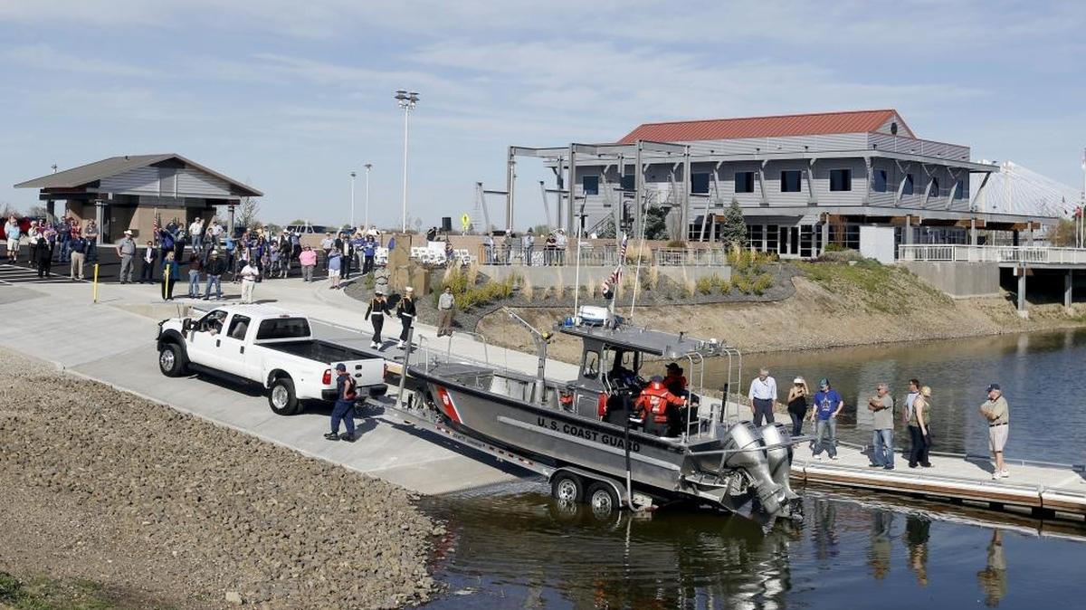 The U.S. Coast Guard launches the first boat off the newly rebuilt boat launch on Clover Island on Wednesday in Kennewick. The launch was closed for nine months for improvements including a new restroom, parking, landscaping and artwork. See a video at www.tricityherald.com.