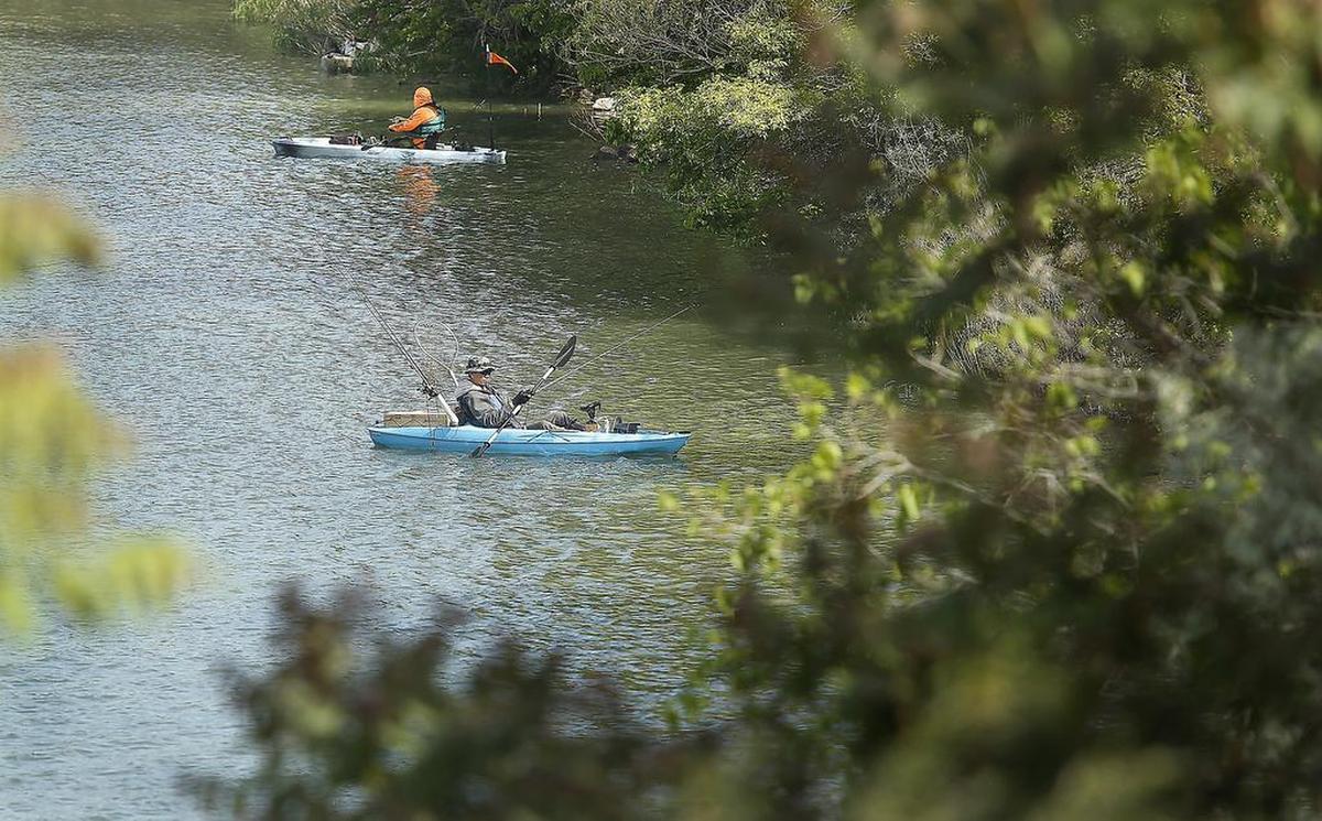 May 8, 2018 - A pair of anglers use kayaks Monday morning to try their luck fishing in the backwaters of the Yakima River near the causeway of Bateman Island in Richland.