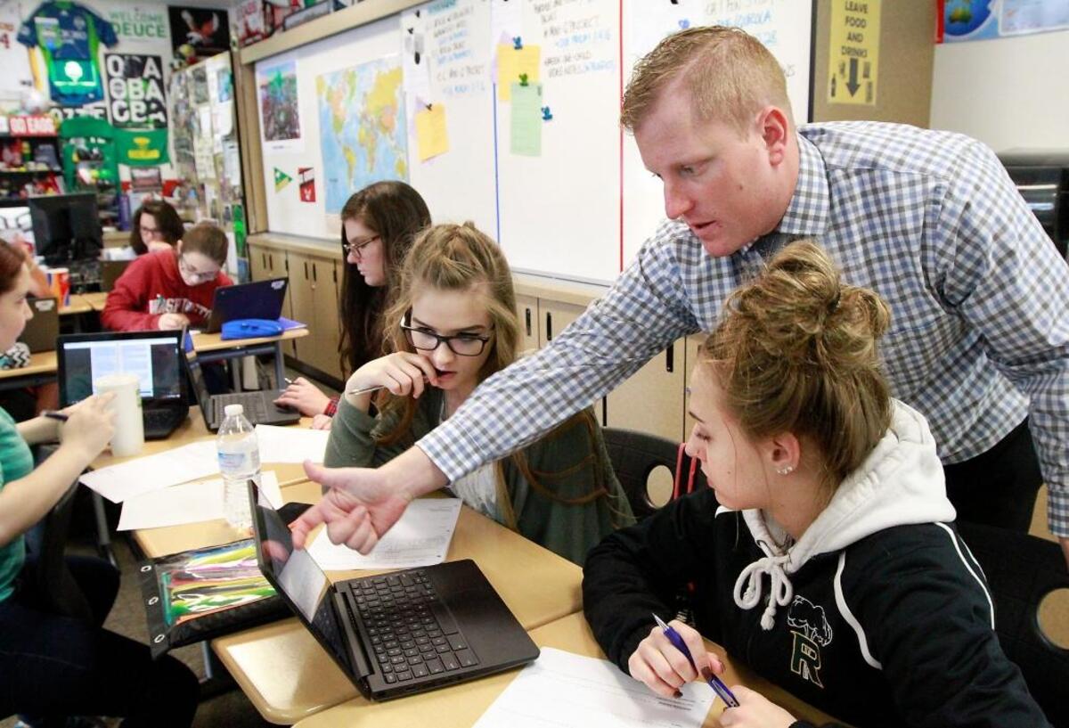 Richland High School teacher Nick White answers a question about during a recent U.S. Government class in this file photo. Richland voters came out strong for the district’s two four-year levies.