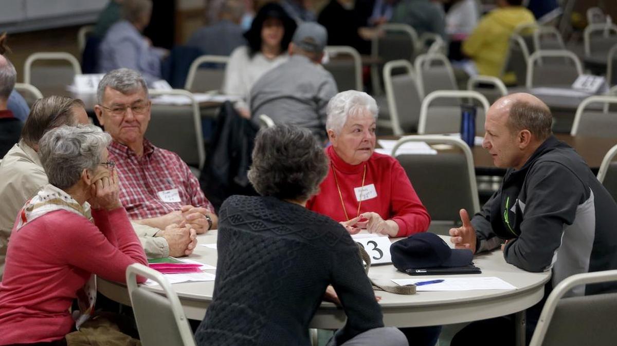 Steve Christensen, right, and Hazel Elliott, both of Pasco, talk about the Republican presidential candidates Saturday during the Franklin County Republican Caucus at Columbia Basin College. While results of the caucus are not shared publicly, voters see the event as an opportunity to get involved in campaigns at the ground level.