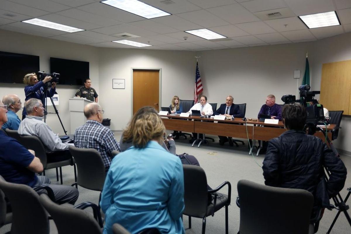 Benton County Prosecutor Andy Miller, center, will ask the Benton County commission to tap its public safety sales tax reserve to start a treatment-focused court for armed forces veterans facing nonviolent misdemeanor charges in the Tri-Cities.