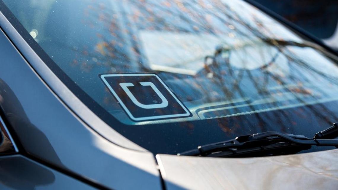 A driver displays a discrete Uber sign in the windshield. The smart-phone based taxi company launches Dec. 15 in Kennewick and will go active in Richland after the city council signs off on new rules on Dec. 20. Pasco will consider rules for Uber in January.