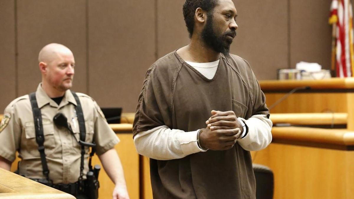 Rayfield Cole is escorted into Benton County Superior Court Monday afternoon for sentencing in the April stabbing of his ex-girlfriend and his brother.