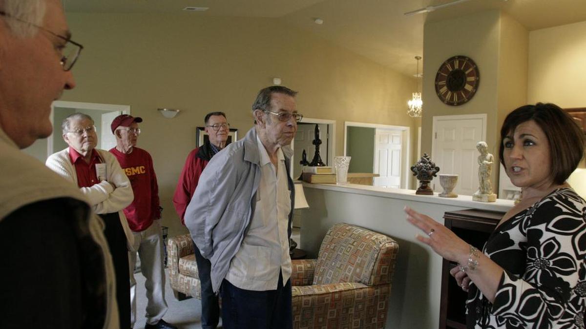 Clyde Painter, center, tours newly finished homes at Canyon Lakes in 2008.
