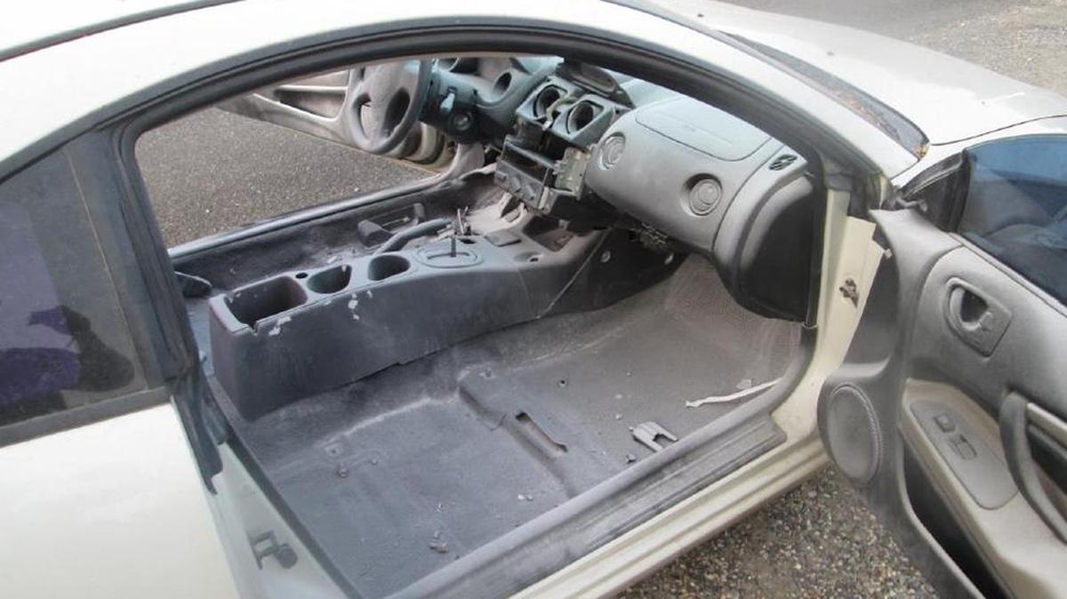 Five people were arrested after Kennewick police found this white Mitsubishi Eclipse parked on the 4400 block of West Seventh Street in Kennewick, stripped of most of its usable parts.