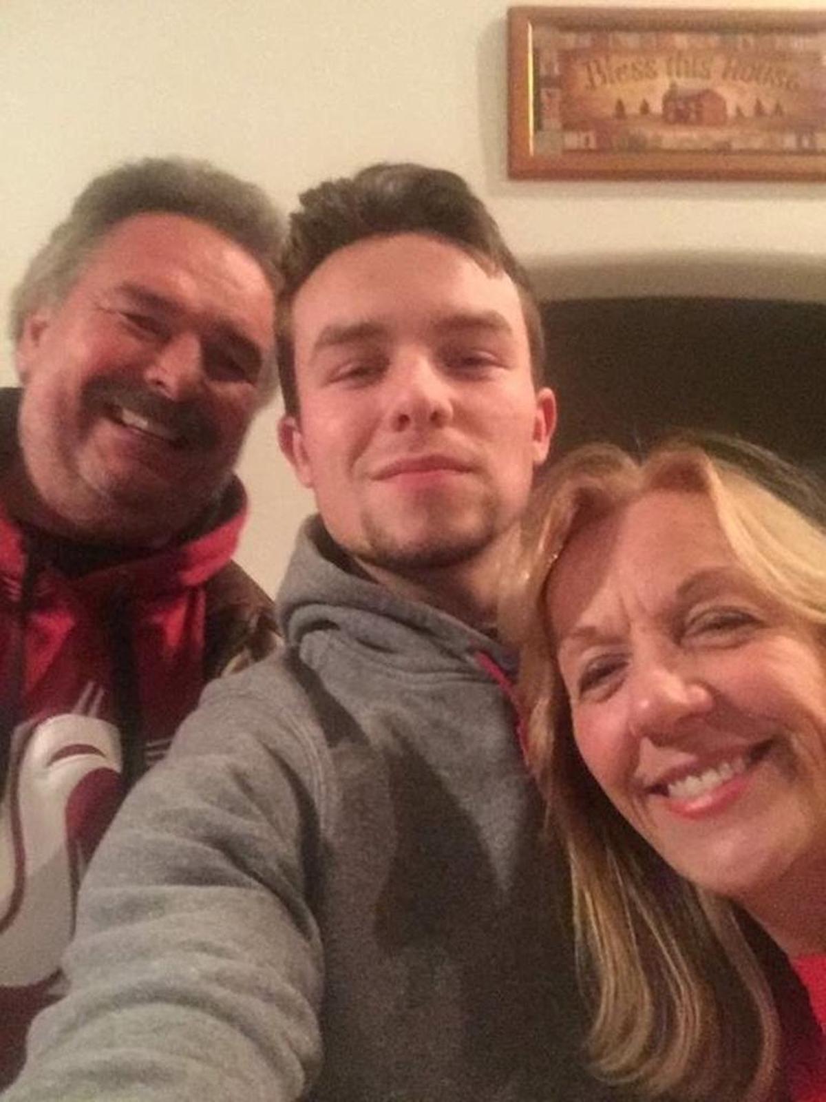 Justin Elzinga, 20, of Kennewick, died in January 2017 after suffering a brain aneurysm. Justin is pictured here with his mom and dad, Jeff and Becky Elzinga.