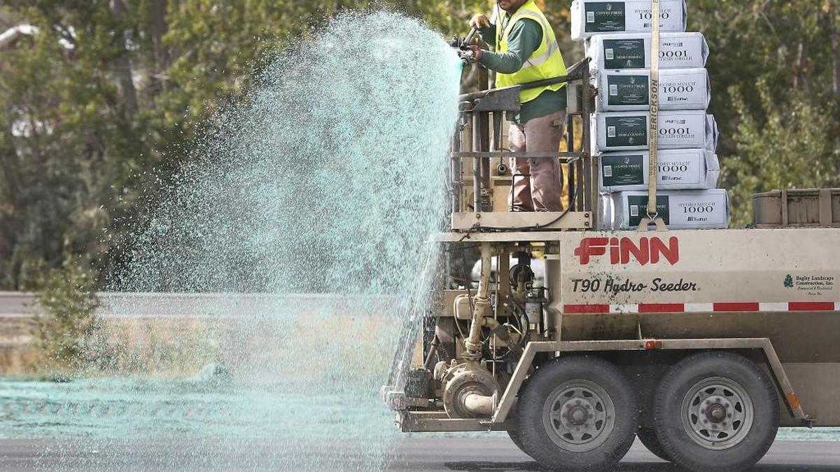 
Jose Martinez, an employee of Bagley Landscape Construction of Pasco, oscillates the nozzle of a hydro seeding trailer while spraying the excavated site for future commercial buildings in the 400 block of Keene Road in south Richland. Martinez said they were spraying the location as a dust control measure until the new construction begins.
