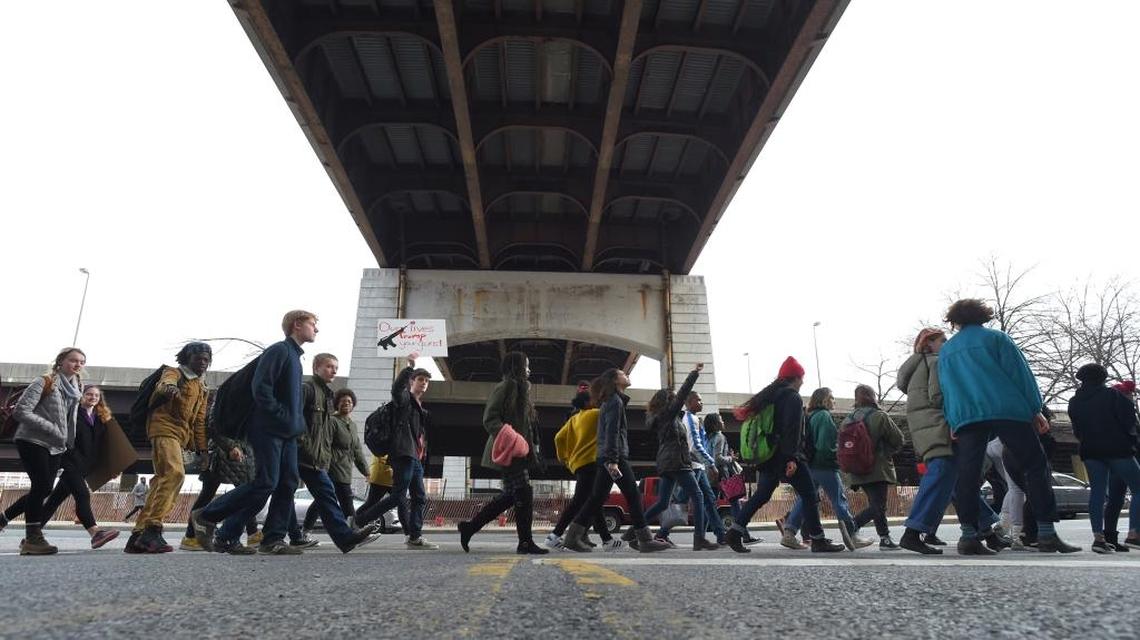 Students from Baltimore School for the Arts walk along Guilford Avenue on their way to City Hall on Tuesday, March 6, 2018 as Baltimore students stage a #gunsdowngradesup school walkout today to protest gun violence in schools and the city.