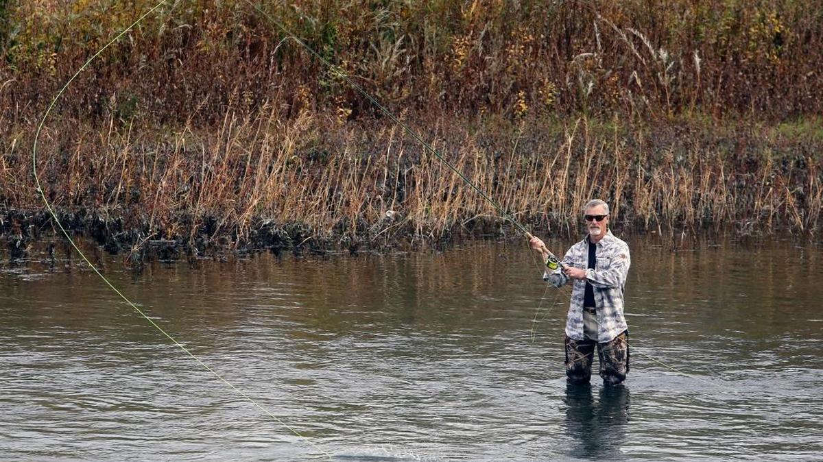 
Craig Swanson of Benton City casts a line Monday into the Yakima River in West Richland while fishing for salmon with a technique called spey casting. The warm fall weather will continue through Thursday with highs in the upper 60s, according to the National Weather Service.

