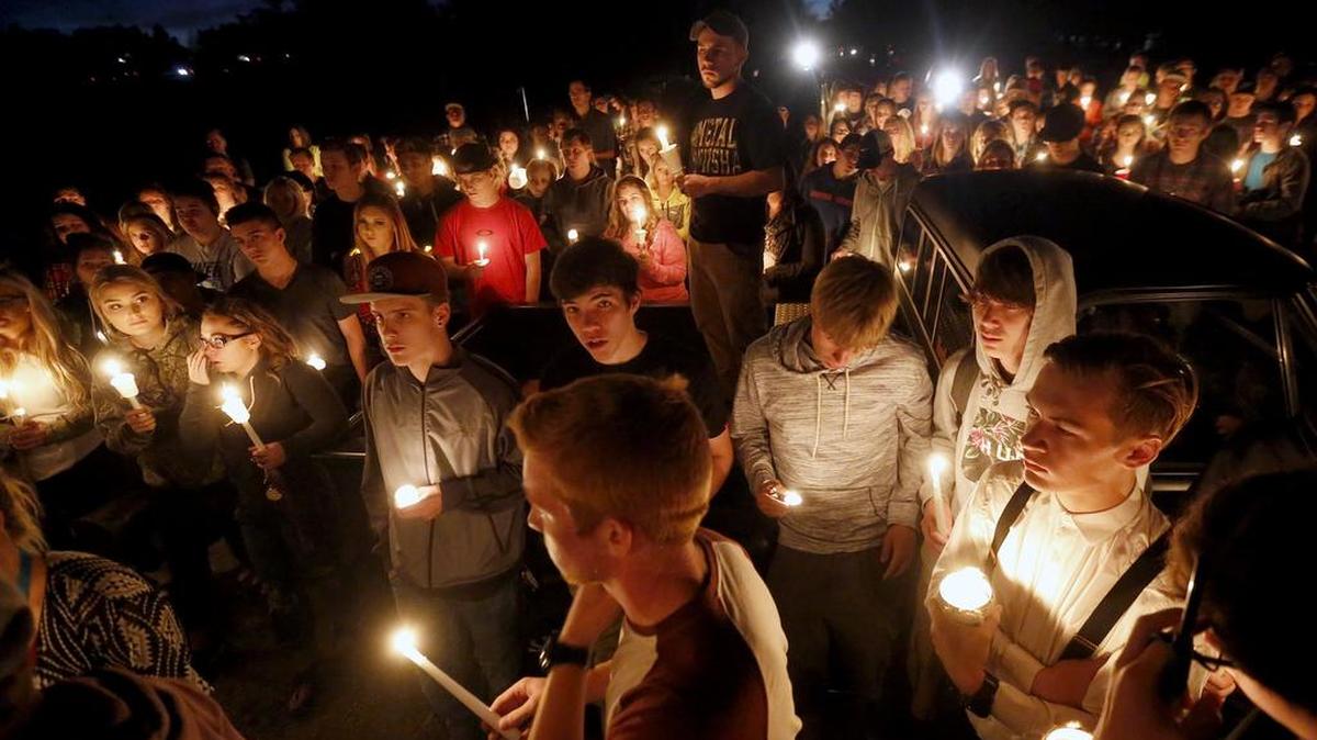 
Classmates and friends of Kamiakin High School junior Andrew Dayton gather for a vigil at the duck pond in Columbia Park on Tuesday evening. A few hundred people gathered during the vigil, standing on a pickup as they shared memories of Andrew, 16, who was killed in a rollover crash Monday night. “I have no words to say looking out to all of you,” said Andrew’s father Jon Dayton, “I know he is looking down on us, smiling, and duck hunting.”
