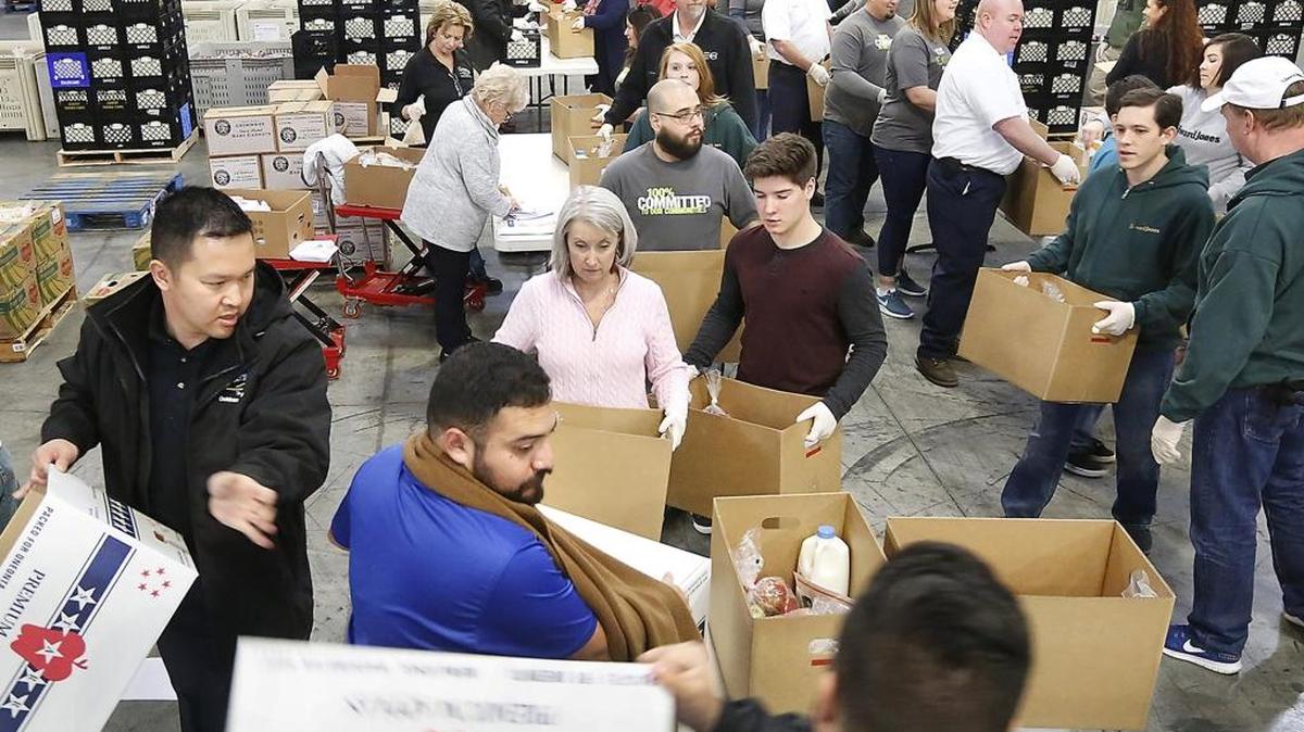 Nearly 100 volunteers line up to assemble Thanksgiving meal boxes Thursday at the 2nd Harvest facility in Pasco. The 2,000 holiday meals are part of the nonprofit’s second annual Turkey Drive online fundraiser. Distribution of the meals is scheduled to start at 11 a.m. on Nov. 18 at the Benton County Fairgrounds in Kennewick. The food will be given on a first-come, first-served basis, while supplies last. Watch a video at: tricityherald.com/video.