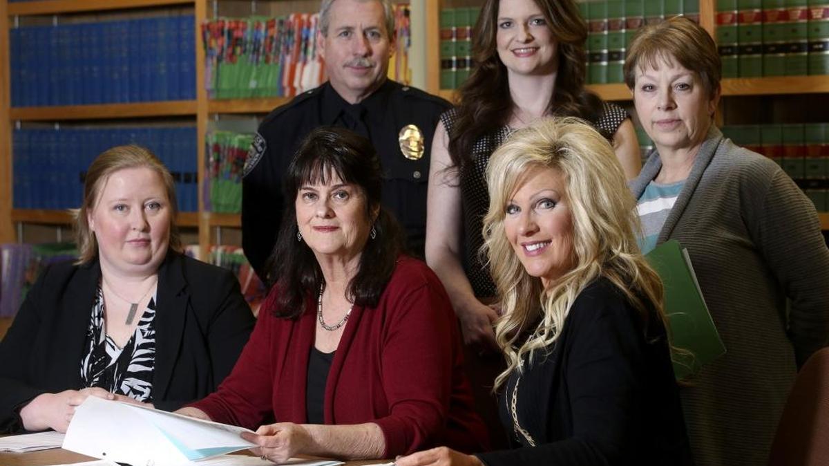 Members of the new Mental Health Court at Benton County District Court go over potential cases Tuesday during their first meeting in the law offices of the Benton County Justice Center. Front row from left: Deputy Prosecutor Megan Killgore, Judge Katy Butler, defense attorney Dawn Hickman. Back row from left: Kennewick police officer Wes Gardner, program manager Tara Symons and probation manager Reva Kirby.