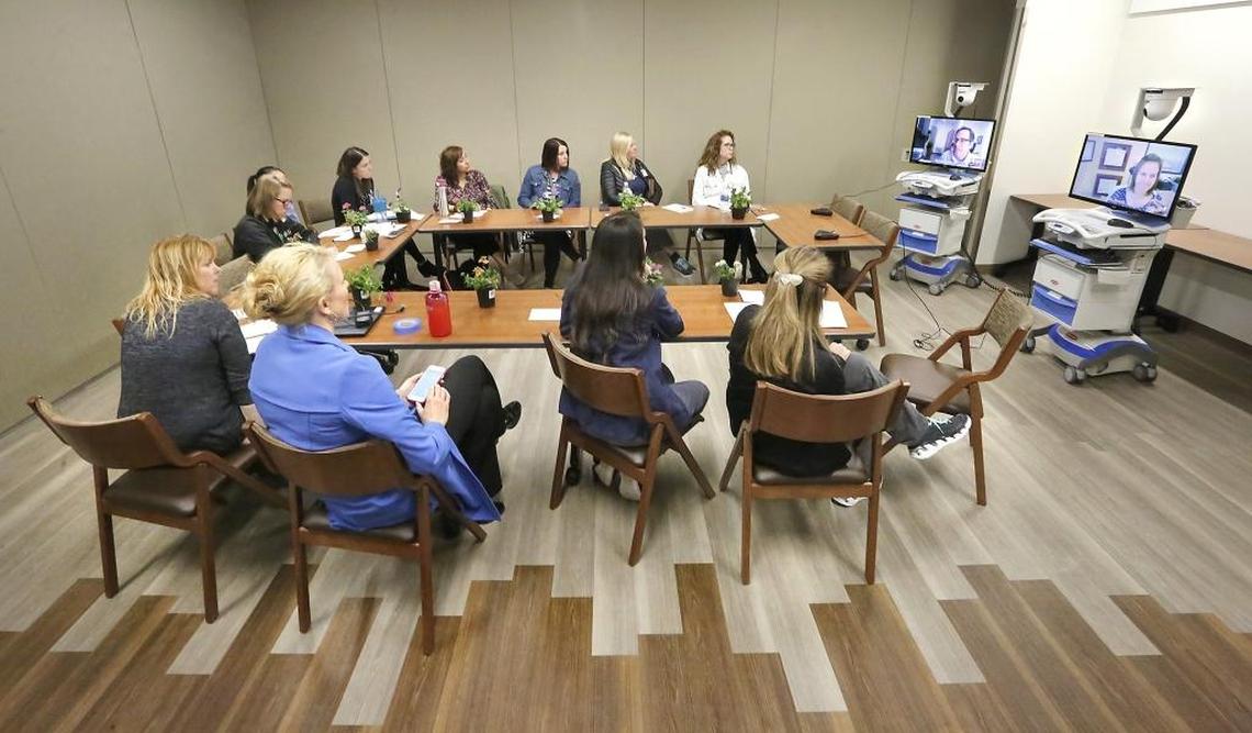 A team of multidisciplinary health care professionals from Kadlec hold a video-conference with Dr. Michael Elliott, left, and Dr. Michele Arnold of the Swedish Neuroscience Institute in Seattle after follow-up appointments Tuesday with several Tri-City area ALS patients at the Kadlec ALS Clinic. The new clinic is being held in the Kadlec Healthplex facility on Lee Boulevard in Richland. Watch a video at: www.tricityherald.com/video