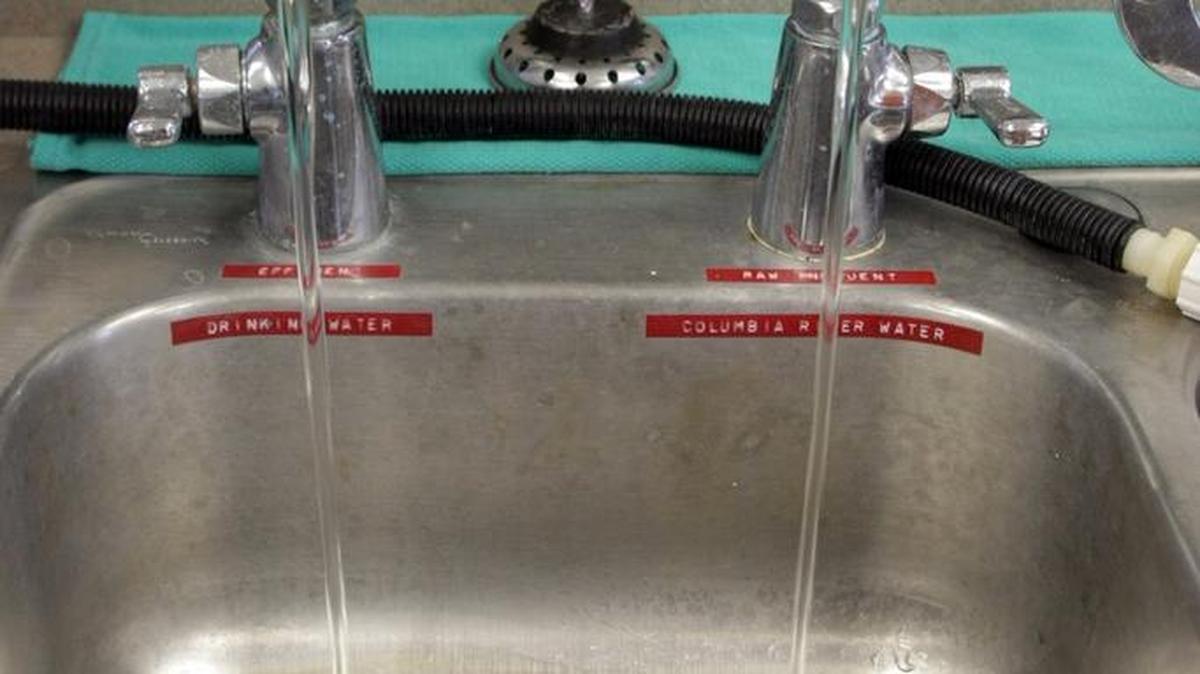 Two faucets that are used for water quality sampling run continually at the water treatment plant in Pasco. The left one is treated drinking water and the other is water directly from the Columbia River.