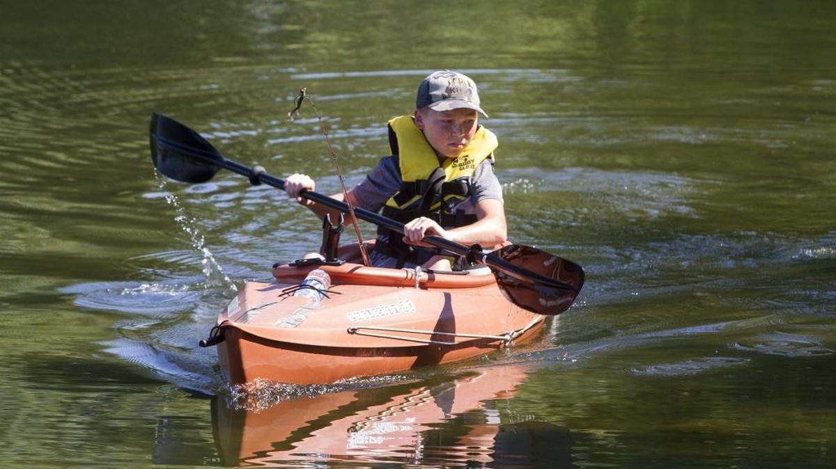 Bryce Ford, 15, paddles to a better spot so he can fish on the Columbia River at Two Rivers Park in Kennewick on Thursday morning. Ford was fishing with friends while the temperature was in the mid-80s. Friday’s high is expected to be near 95, according to the National Weather Service.