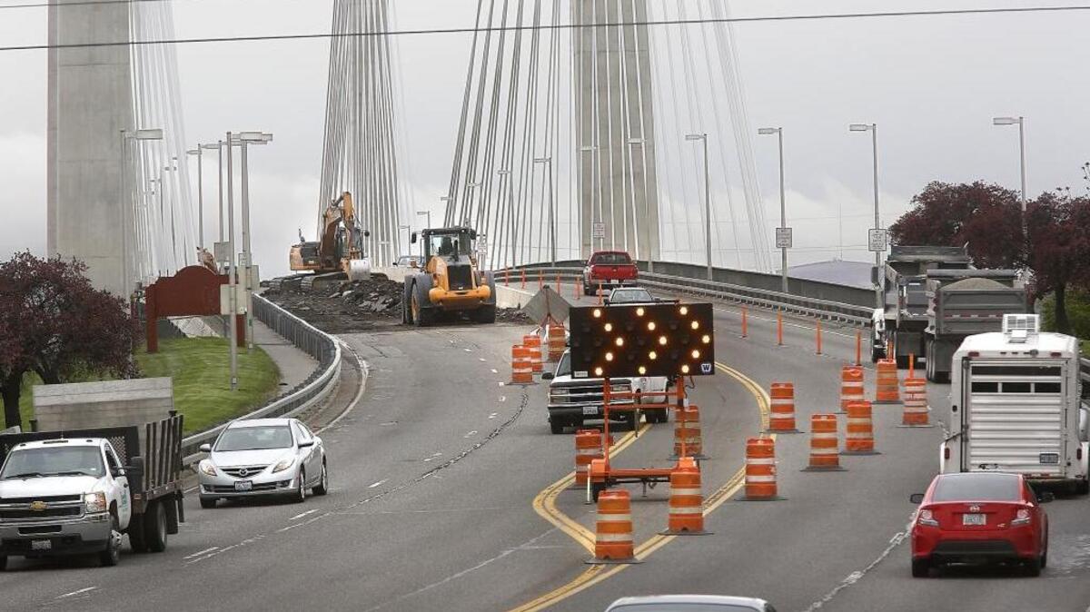 Crews rip up the asphalt paving from the northbound lanes of the cable bridge Wednesday. The work is a part a $2.35 million project to repair the decking, install a waterproof membrane and repave all four lanes between South Yew Street in Kennewick to South 10th Avenue in Pasco. Expect lane closures and minor delays during the work is expected to finish by May 24. Central Washington Asphalt is the main contractor, according to Washington Department of Transportation officials.