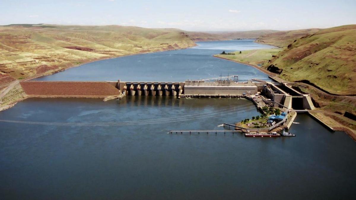 A small drawbridge crosses the lock area of Little Goose Lock and Dam on the Snake River, with the lock seen on the right.