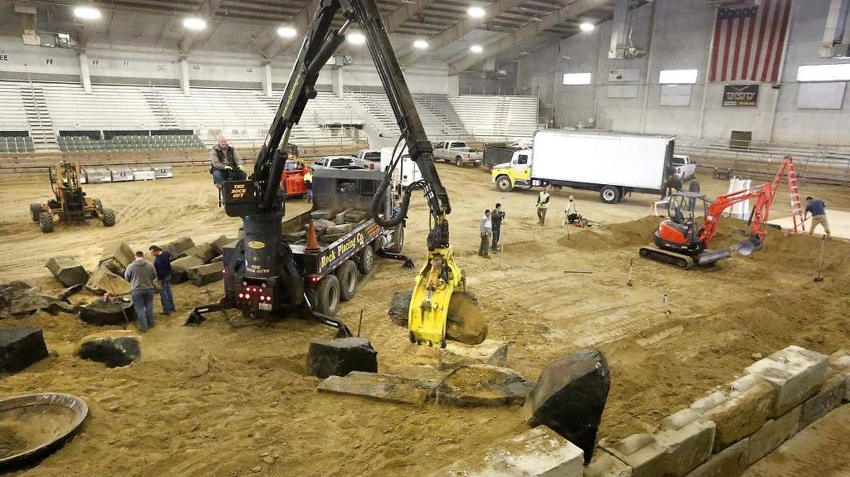 Guy Smith, an employee of Rock Placing Co., moves boulders into place for the 2017 Regional Home & Garden Show at the TRAC facility in Pasco. The annual three-day show by the Home Builders Association of the Tri-Cities expects about 200 exhibitors and opens at 10 a.m. Feb. 24. Admission is $6 adults, with $1 off for a non-perishable food donation for the Salvation Army. Kids 12 and under are free.