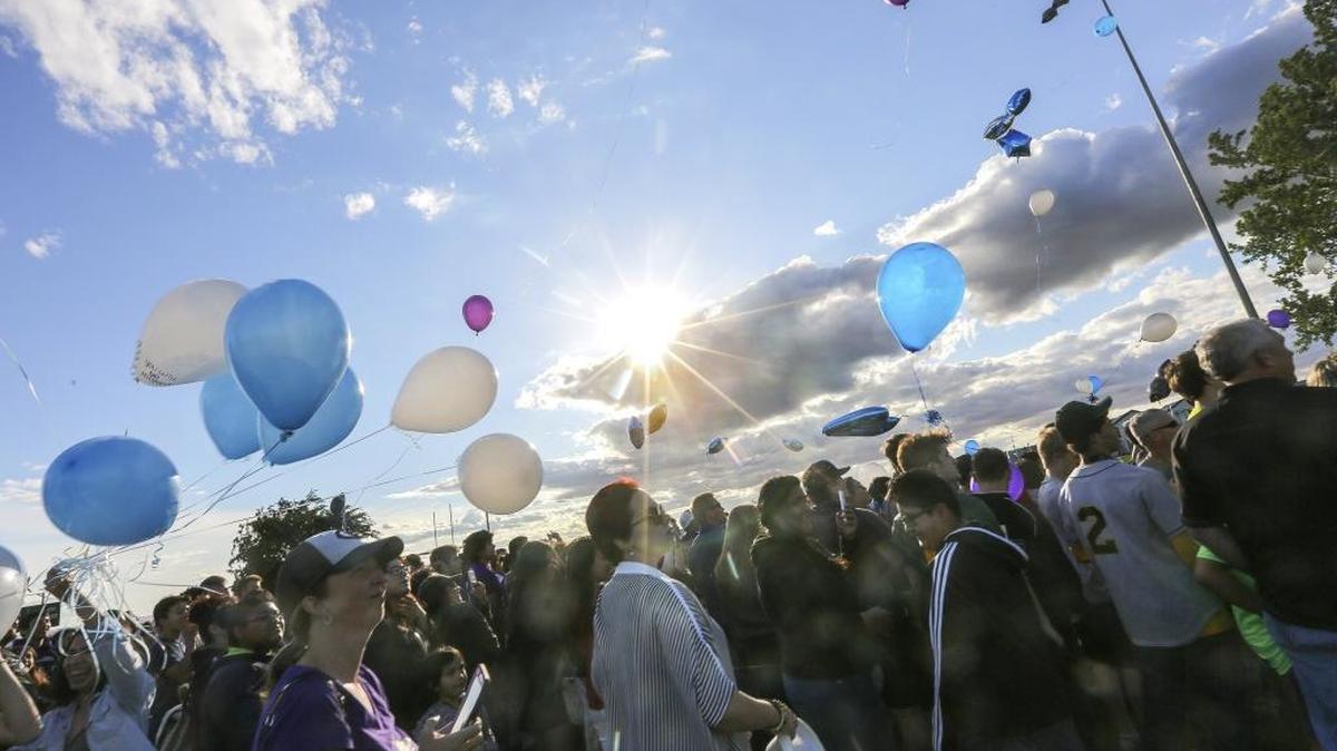 Friends and family gather Friday evening at the Pasco youth football field to release balloons remembering Rey Aranda, a Chiawana High School freshman who died June 9.