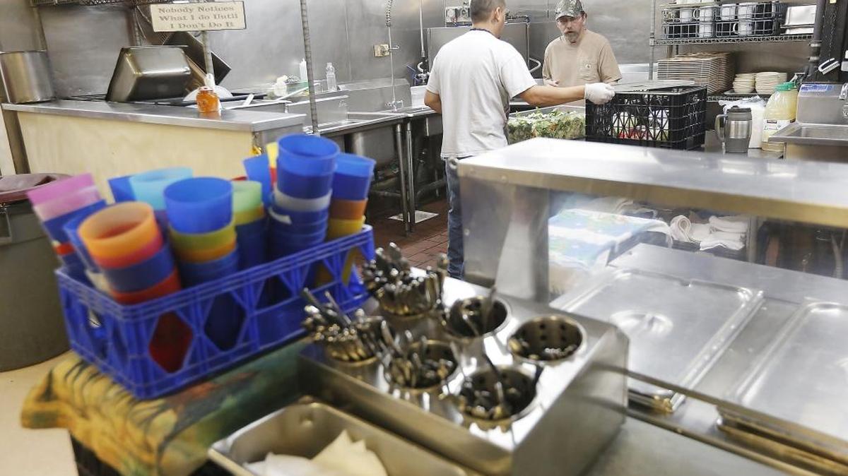 Silverware and cups are stacked in preparation for a lunch at the Tri-City Union Gospel Mission men's facility in Pasco. Volunteers will be serving Thanksgiving dinner at the facility.