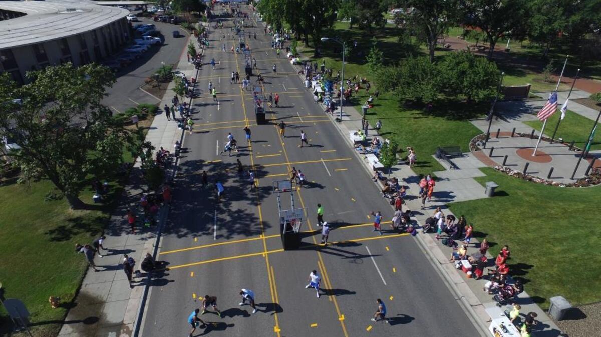 Players take part in the See3Slam 3 on 3 basketball tournament Saturday on George Washington Way in Richland. The event continues through Sunday evening.