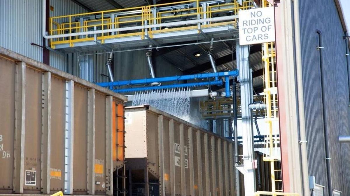 BNSF Inc. invested $26 million to build a facility in Pasco that coats passing coal loads with a glue-like substance to minimize coal dust in anticipation that Millennium Bulk Terminals would increase demand for coal-by-rail services. The state denied a key permit for Millennium’s Longview export terminal Tuesday.