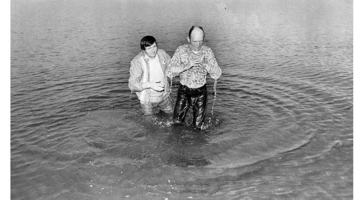 Rev. Arden Roush, left, baptizes retired Air Force sergeant Lee Dawson in the Columbia River at Two Rivers Park in Finley. The river was a chilly 41 degrees. The photo was published on Christmas day in 1974.