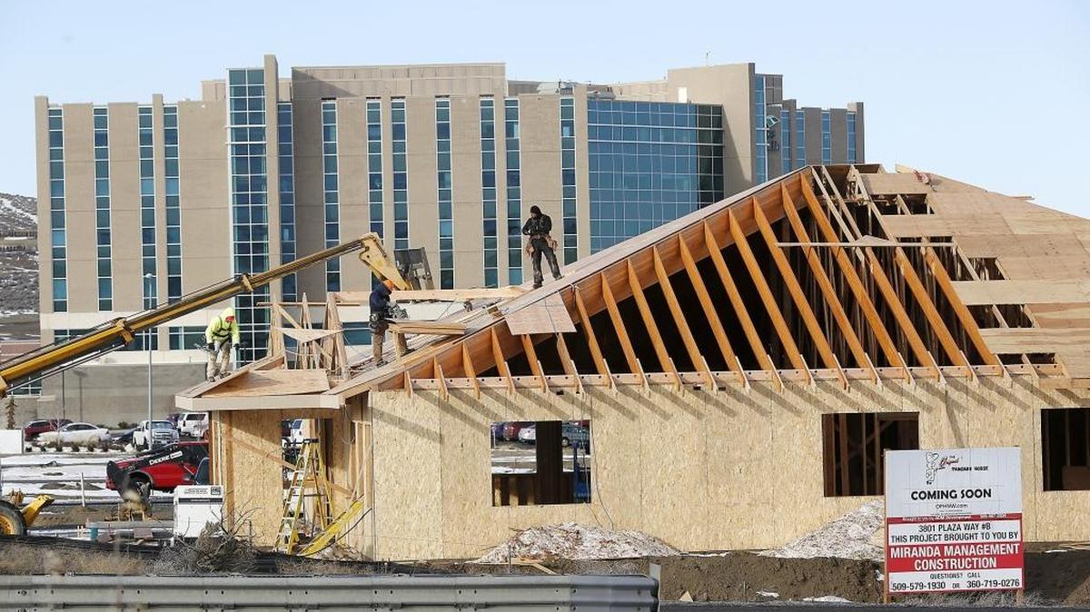 Construction workers concentrate their efforts Tuesday on the roof of the new Original Pancake House going up in the Southridge area of Kennewick. The $1.2 million restaurant is set to open in early 2017 and employ about 40 people. The Mid-Columbia unemployment rate inched up in November but the overall picture painted by the state Employment Security Department shows a healthy economy in its fourth year of expansion.