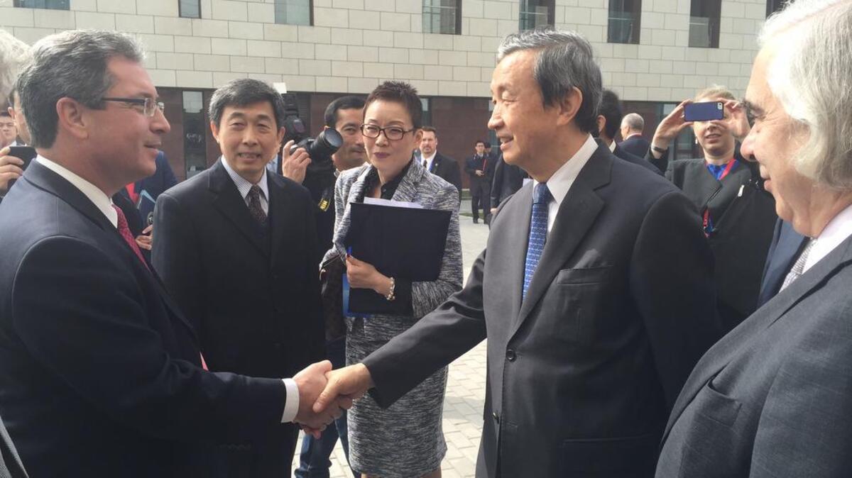 Steven Ashby, the director of Pacific Northwest National Laboratory, left, shakes hands with China’s Vice Premier Ma Kai, now retired, in March 2018 as then U.S. Energy Secretary Ernest Moniz, right, looks on. Moniz and Ashby were in China for the dedication of a new nuclear security Center of Excellence in China.