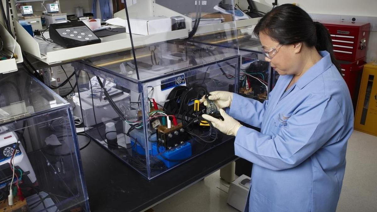 A Pacific Northwest National Laboratory researcher evaluates one of the lab’s vanadium flow batteries. PNNL granted an exploratory license to ITN Energy Systems to try out battery additives PNNL developed to increase the energy density and expand the operating temperature range of vanadium flow batteries.