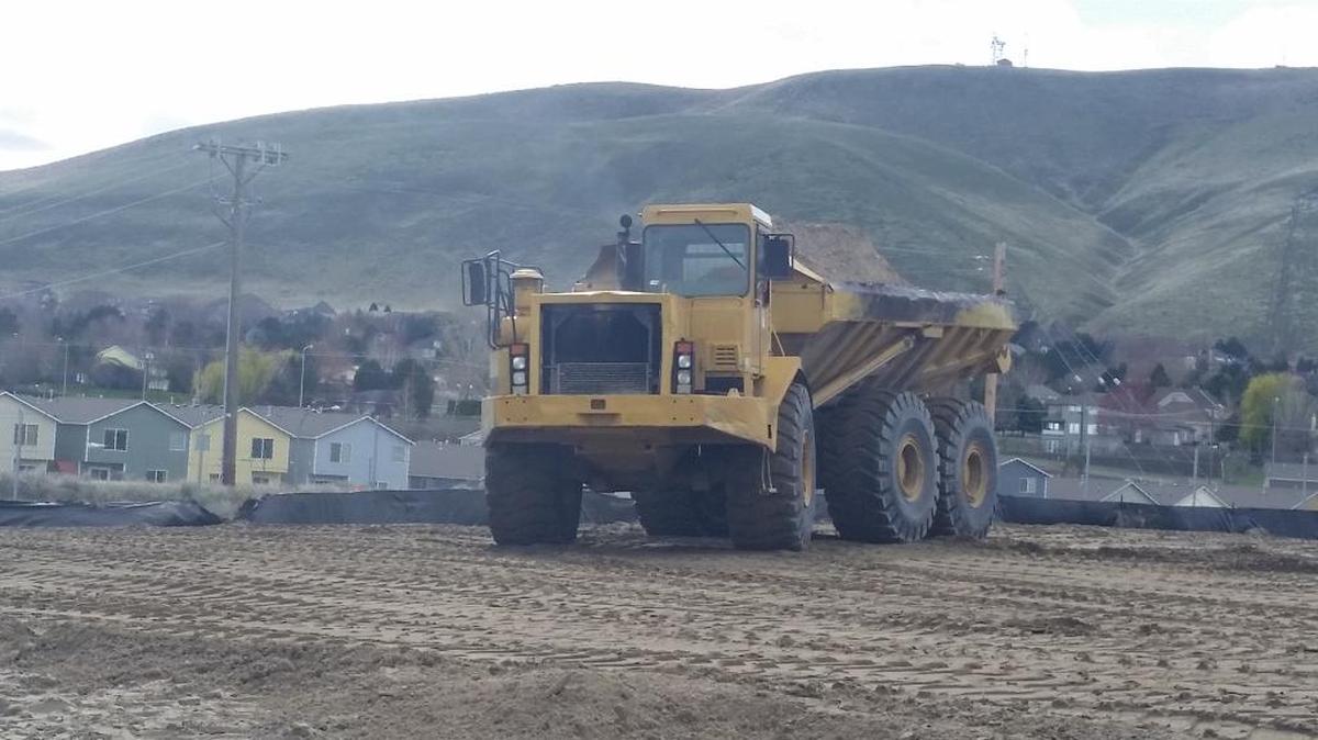 Crews from Rimrock Construction work on the site for a 120-room Home2 Suites extended-stay hotel by Hilton on a parcel behind the Queensgate Home Depot store. It will open in about a year.