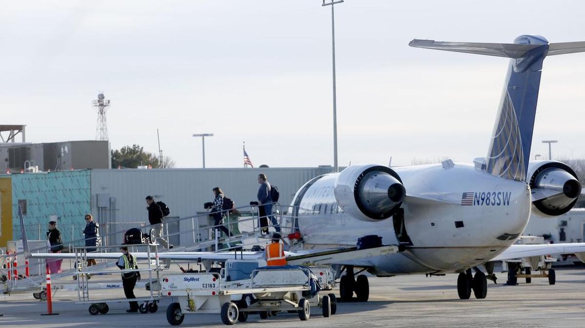 Passengers arrive Thursday at the Tri-Cities Airport on a United flight from San Francisco. Passenger boardings in Pasco climbed 6 percent last year.