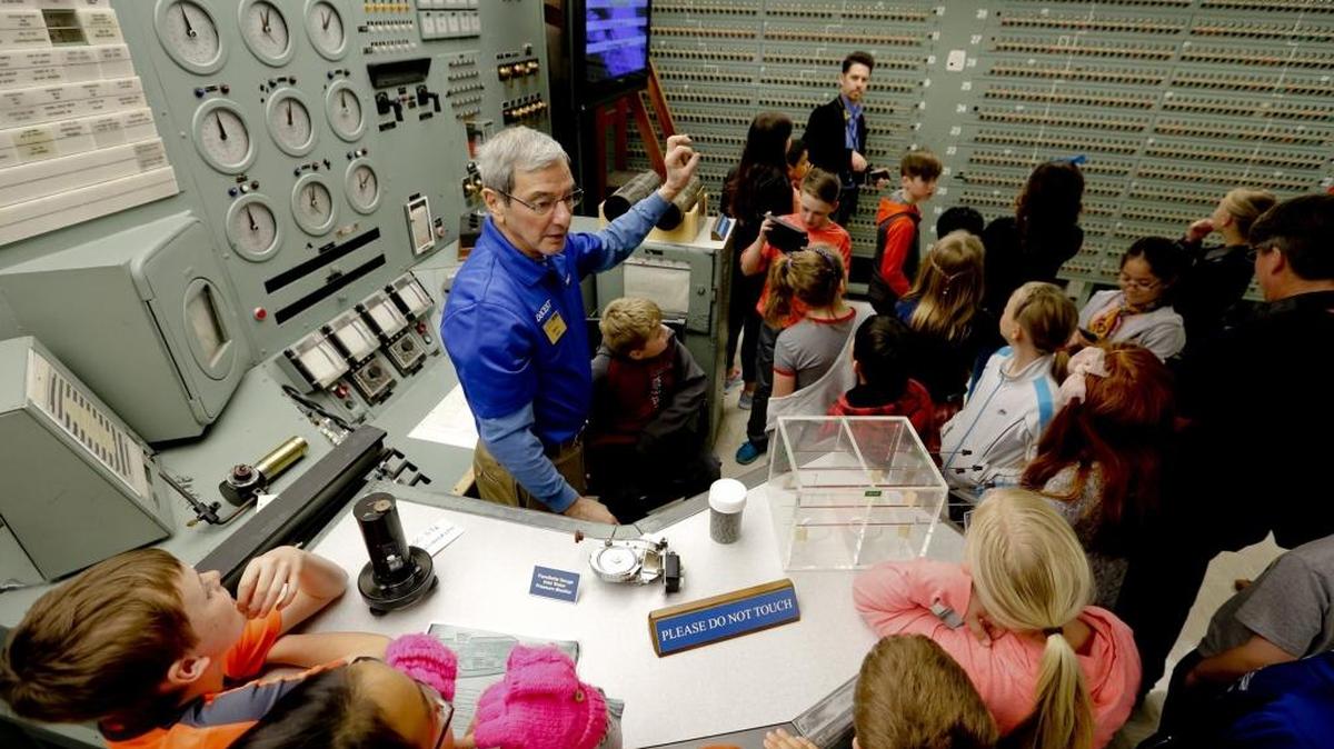 Students check out the control room of historic B Reactor, part of the Manhattan Project National Historical Park.