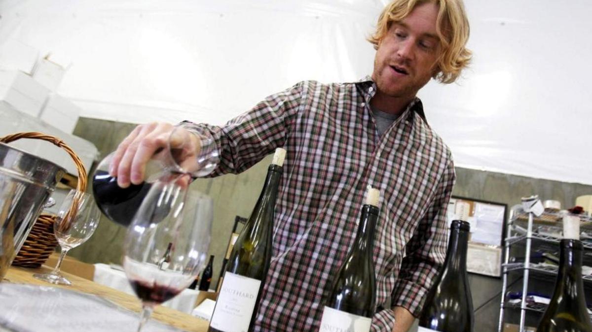Scott Southard pours a sample of Columbia Valley red wine during spring barrel tasting in Selah.