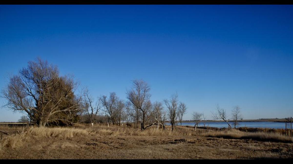 On the banks of Lake Scatterwood, S.D. My mom grew up in a farmhouse here, stuffing rags against the blowing dust and tending the work horses. Now only a shell of a foundation and a rusty clothesline remain – another homestead victim of the great emptying of the plains. Many Dakotans left places like this and headed west to Washington and Oregon to start anew.