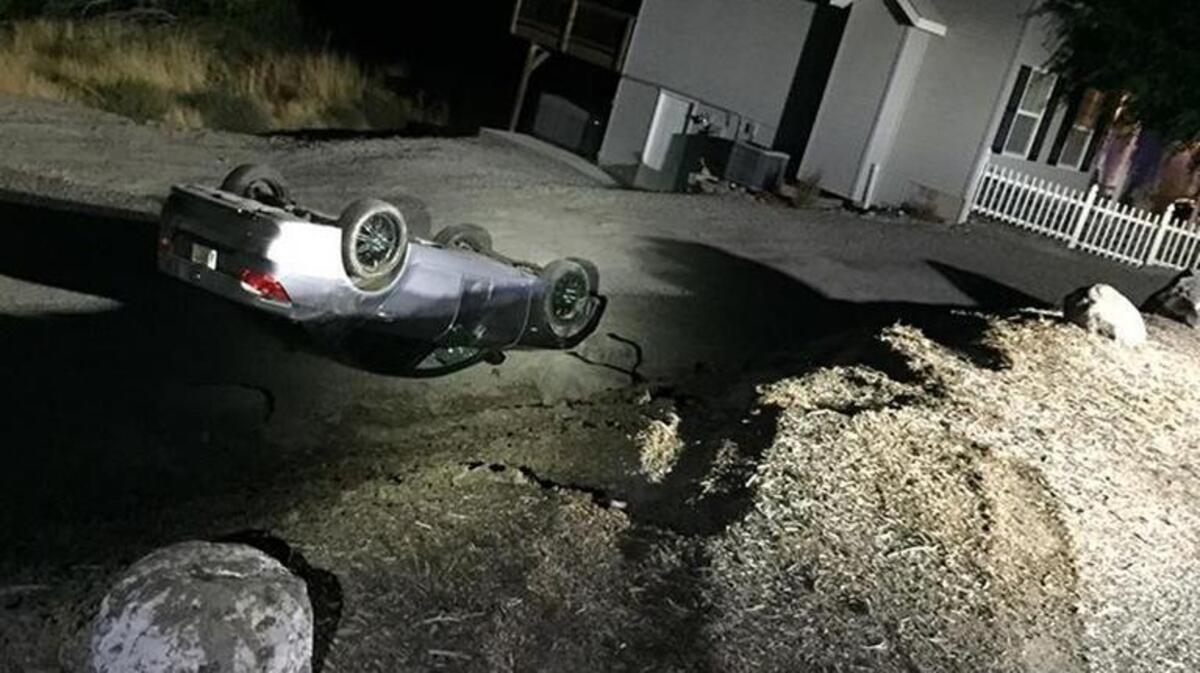 Kennewick police are seeking the driver who rolled a vehicle over an embankment, then fled on foot in south Kennewick Saturday night.