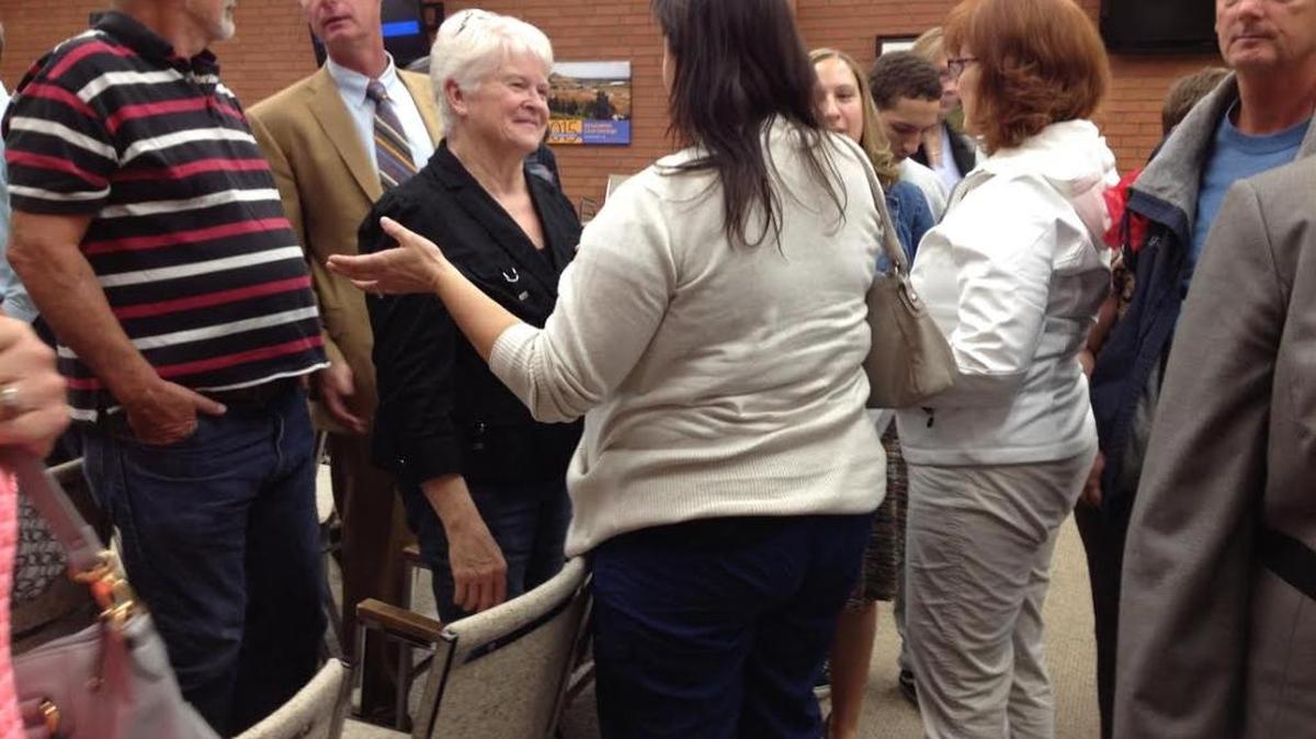
Barronelle Stutzman, wearing black, the owner of Arlene’s Flowers, speaks with supporters after a Kennewick City Council meeting.
