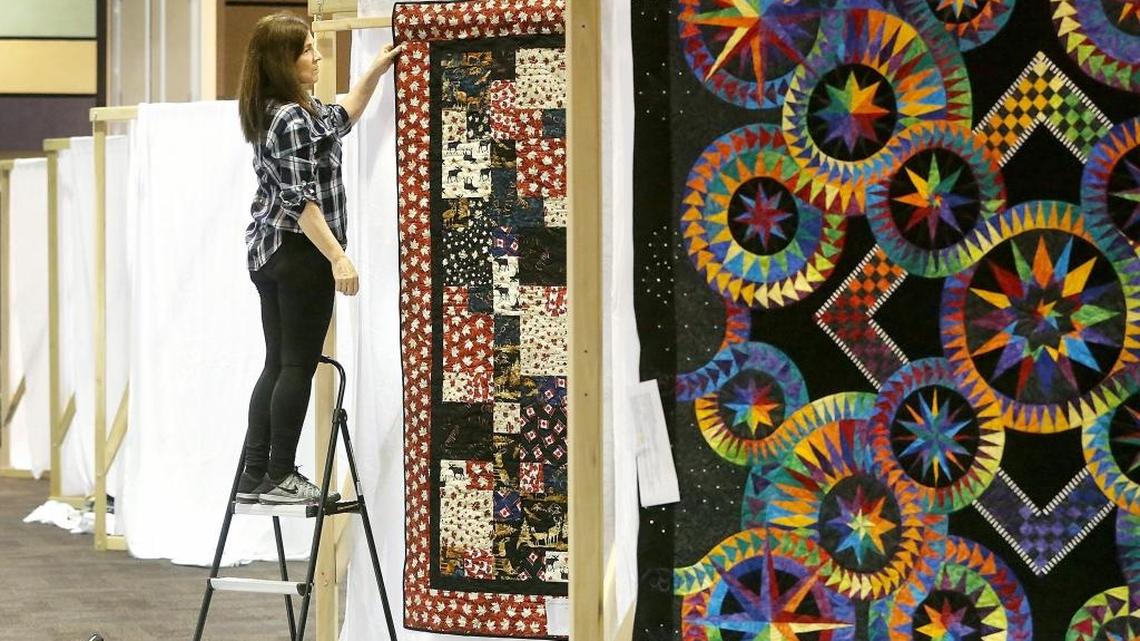 Linda Edmiston of Pasco, a Tri-City Quilter's Guild member, helps hang quilts Thursday for the nonprofit’s 34th annual show at the Three Rivers Convention Center in Kennewick. The building was bustling as participants worked on setting up displays for an estimated 500 quilts for the two-day event. Cost is $8 for two days. Hours are 10 a.m.-6 p.m. March 24 and 10 a.m.-5 p.m. March 25. Watch a video at tricityherald.com/video.