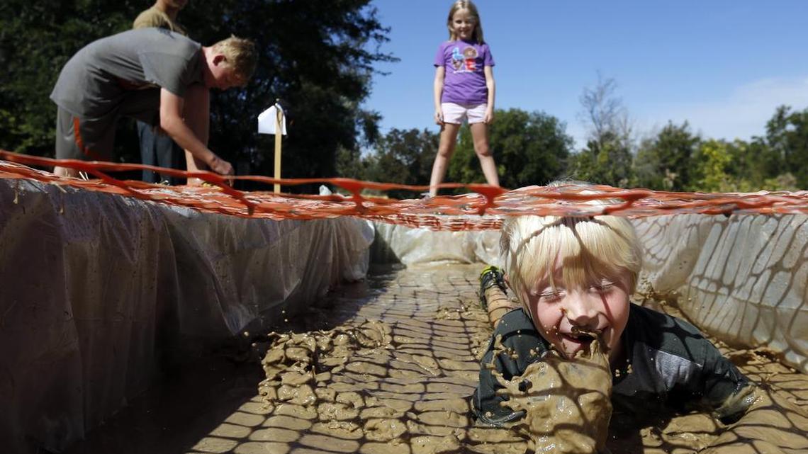 Fun is the reward at Boy Scouts family mud run