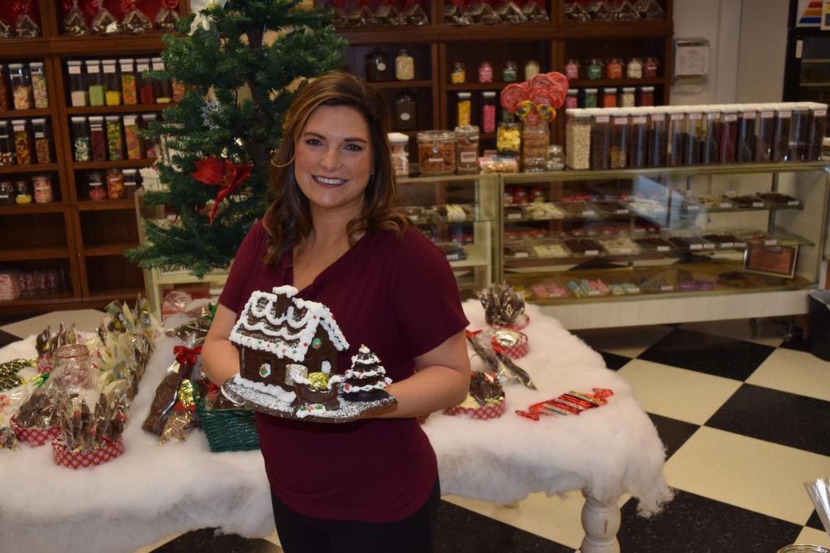 December 2016 - Baum’s House of Chocolate & Gourmet Popcorn co-owner Mindy Sandlin adds a handmade chocolate house to the variety of Christmas candies on display. “In every fiber of this business, God is here,” Mindy said. “I couldn’t do it without him.”
