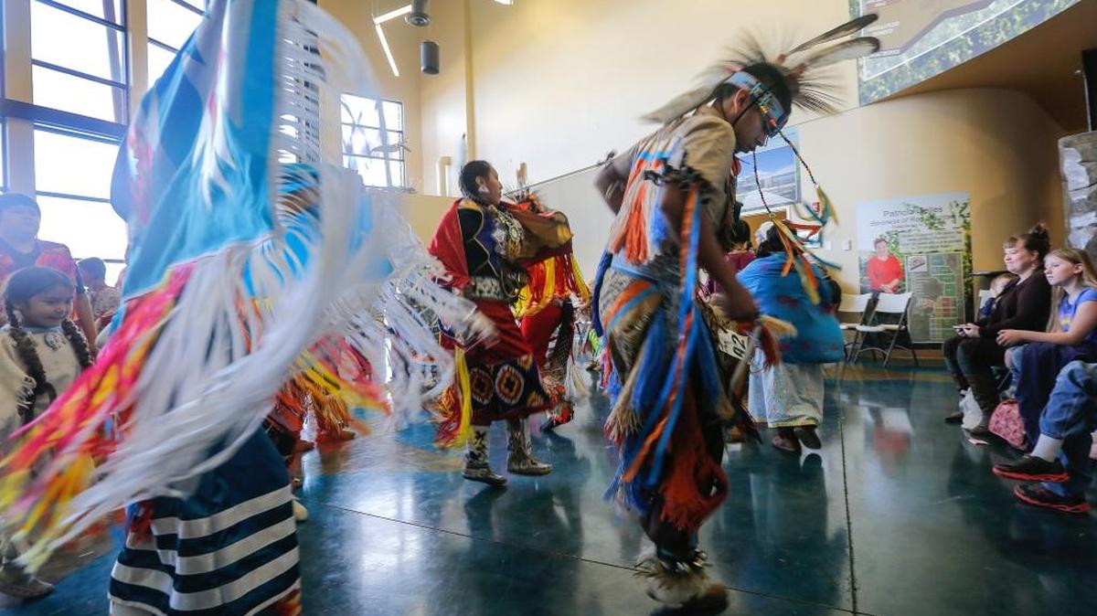 Students with the Nixyaawii cultural dance group perform during the Drummers & Dancers event at the Reach museum in Richland on Thursday. The dancers representing the Confederated Tribes of the Umatilla Indian Reservation were performing various cultural dances in honor of Native American Heritage Month.
