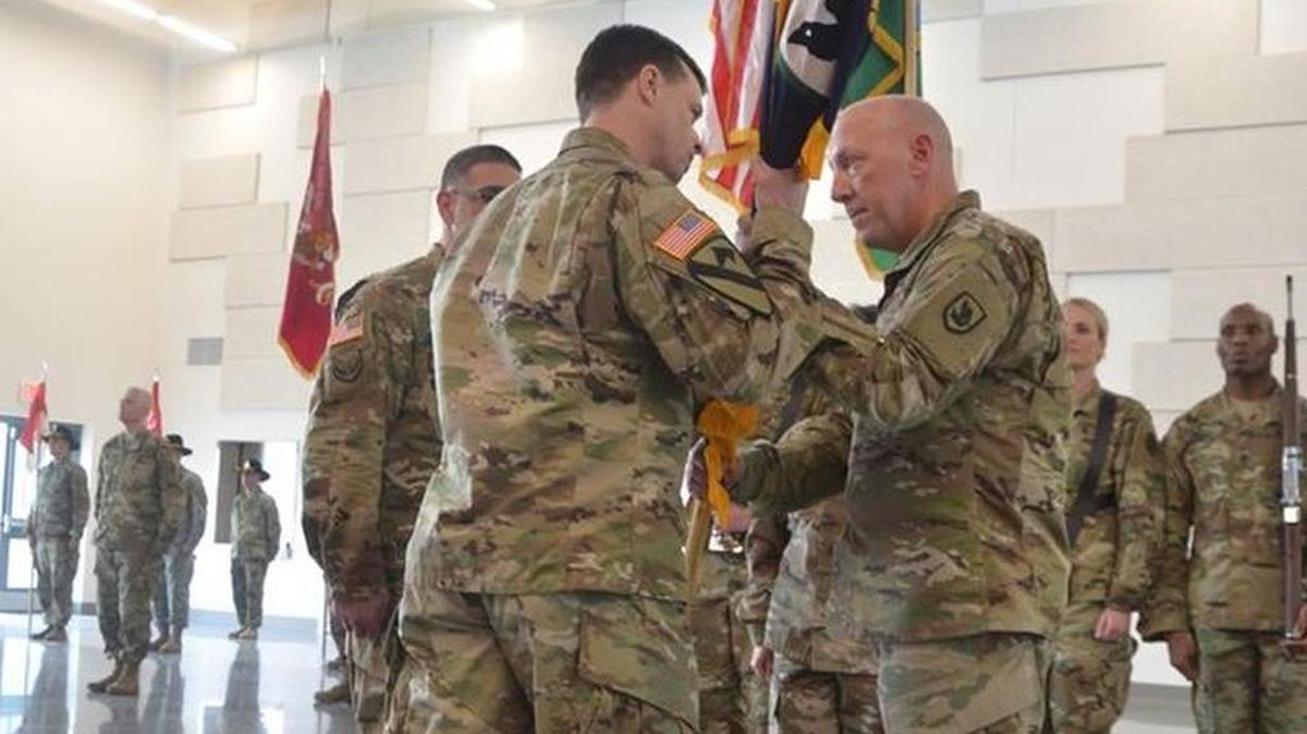 Washington State National Guard soldiers talk in a Readiness Center.