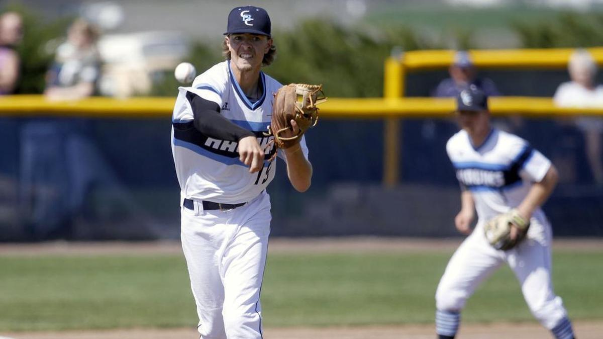 April 3, 2016 - Columbia Basin College pitcher Tanner Simpson throws to first to get the runner.