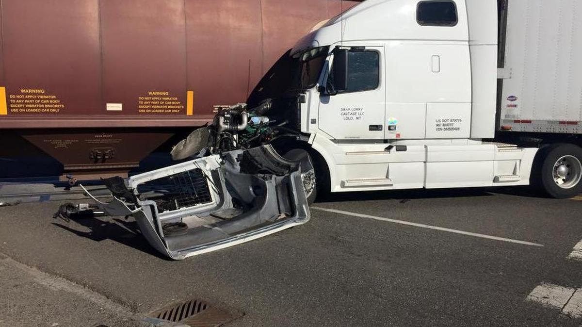 A semi truck crashed into a moving train Tuesday afternoon at a crossing in Pasco. The truck apparently was stopped at the crossing at Oregon Avenue and A Atreet when it began to roll forward, police said.