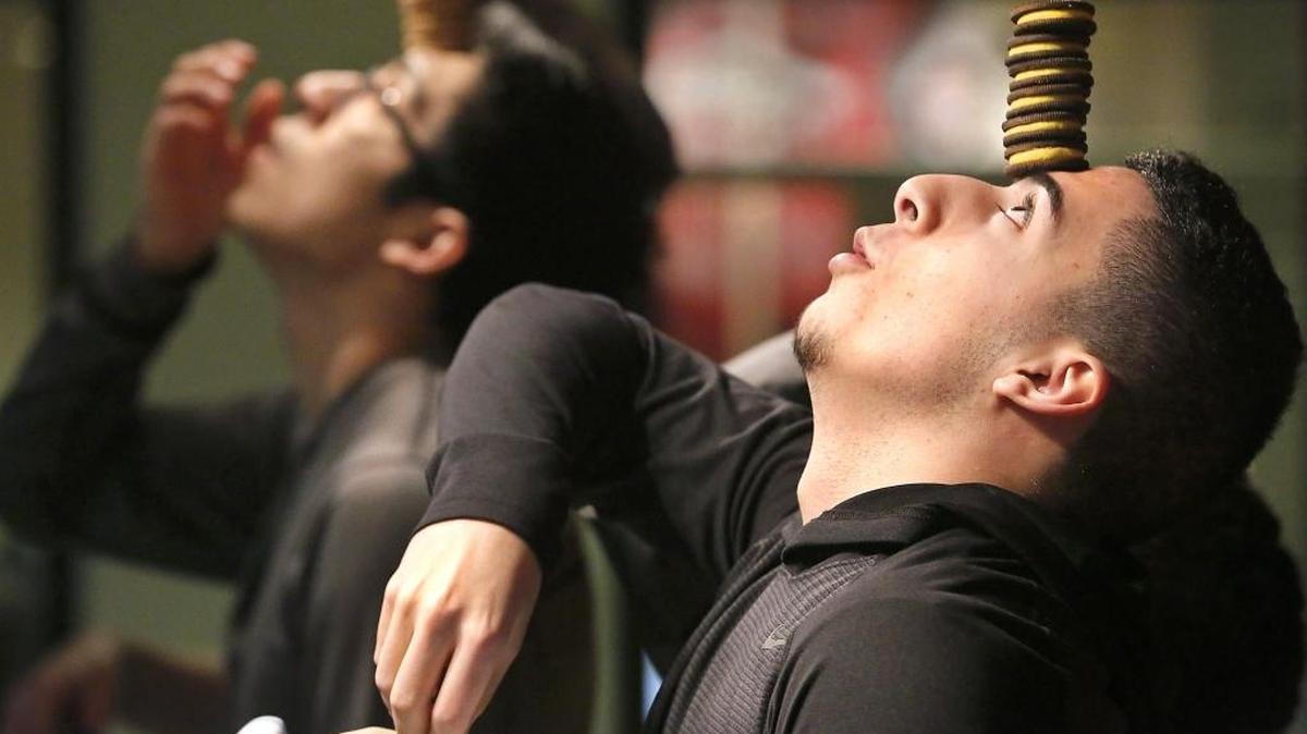 Danny Suarez, 16, of Pasco, concentrates Monday during the balance competition of the National Oreo Cookie Day celebration at Columbia Basin College in Pasco. The timed event was one of several games organized by the Associated Students of Columbia Basin College. Participants won packages of the popular sandwich cookies. Watch a video at tricityherald.com/video.