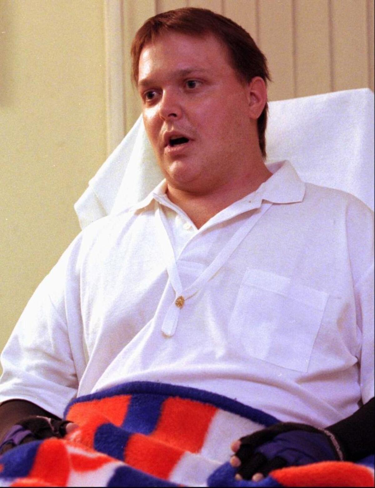 Harold Livingston of Finley. responds to reporters questions on Feb. 21, 1996 a month after the Aero-Med plane crash.